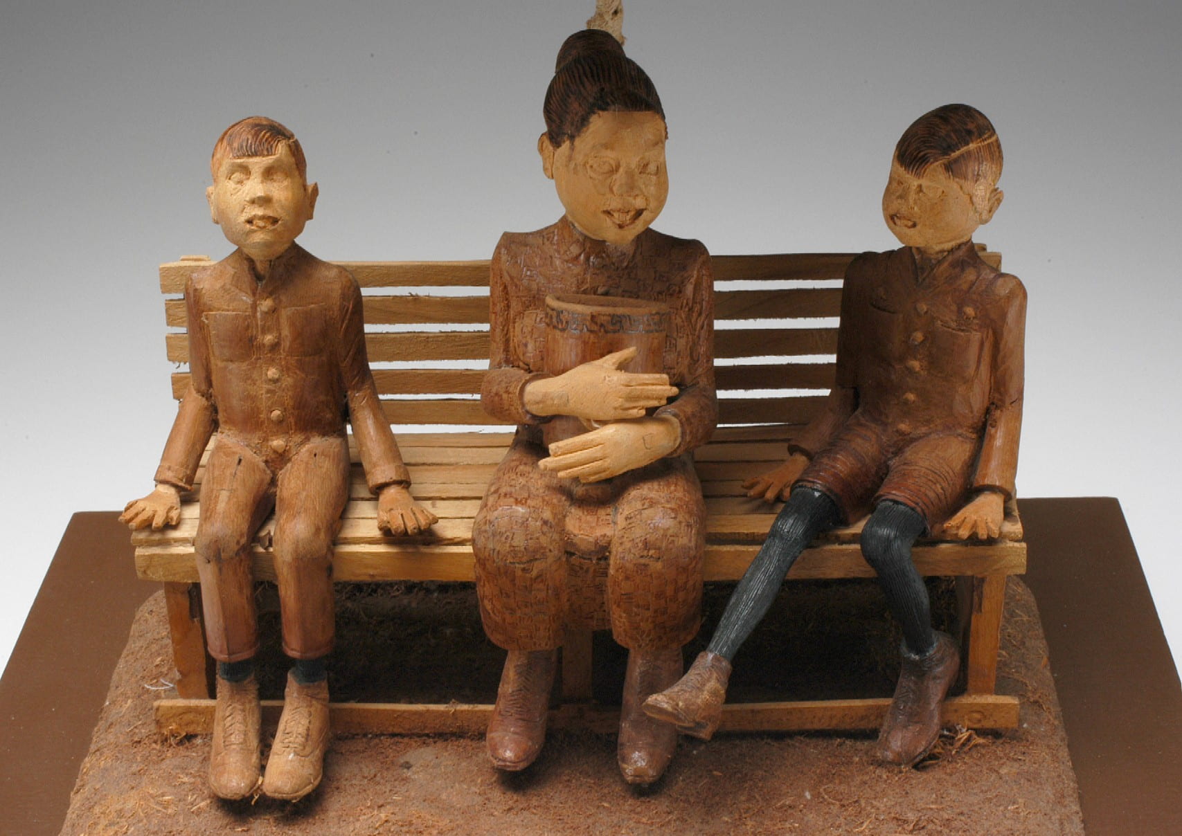 Detail of a sculpture of a mother and sons